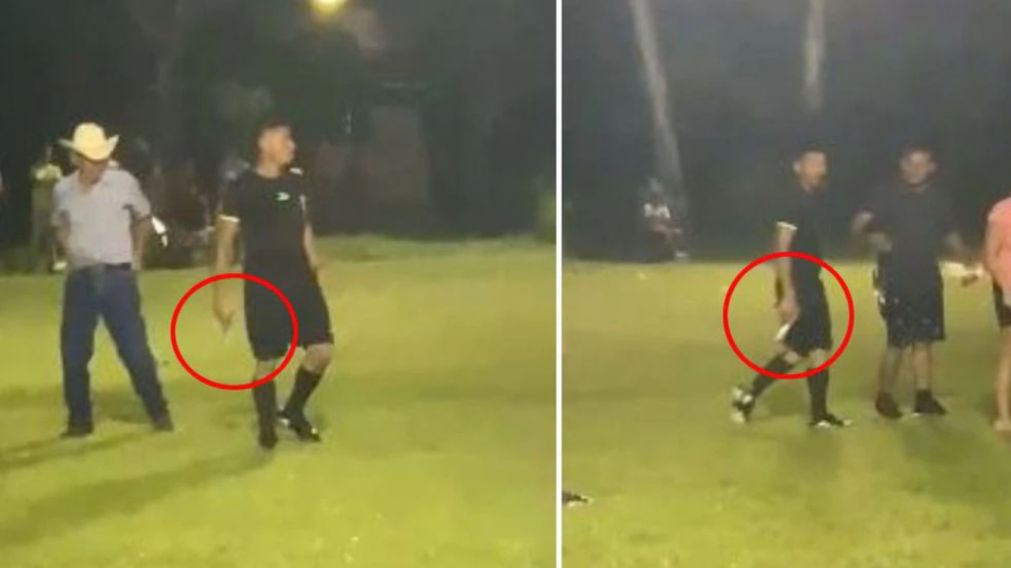 Un árbitro fue increpado por varios hinchas y sacó una arma de fuego para defenderse (imagen captura vídeo).