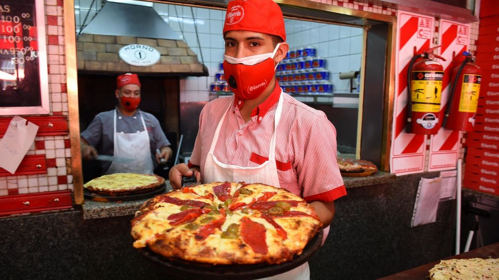 La pizza es uno de los platos favoritos de los porte�os y el resto del mundo desde hace casi un siglo (Jonatan Moreno/Cr�nica).
