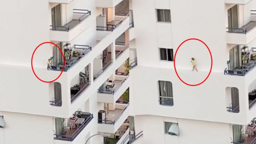 Aterrador momento en que una nena camina por cornisa de edificio.