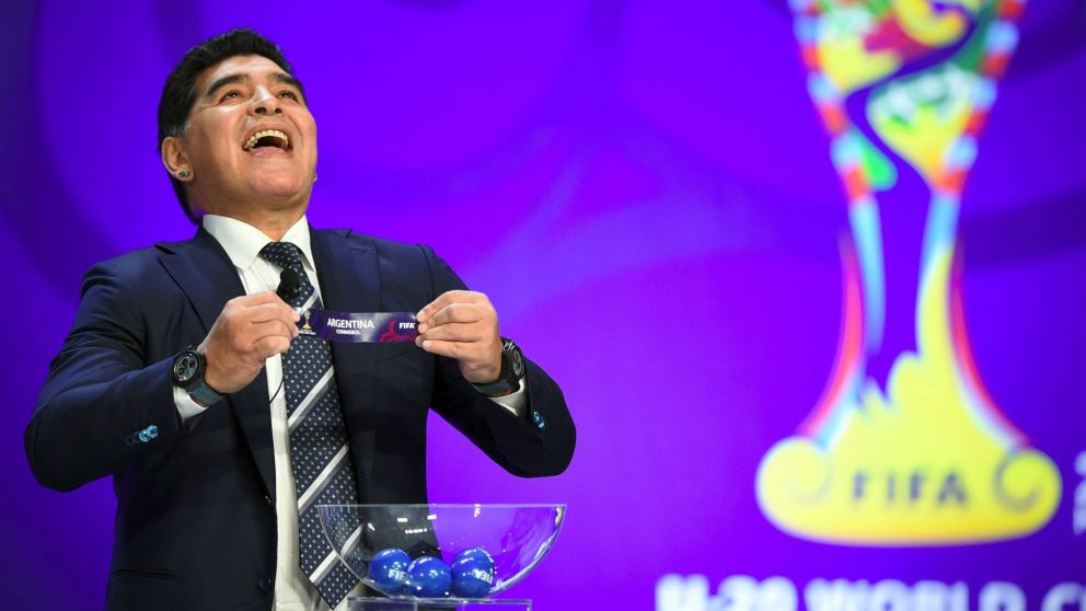 Argentinian football star Diego Maradona reacts as he holds the name of Argentina during the official draw for the FIFA under-20 football World Cup in Suwon, south of Seoul, on March 15, 2017.
The FIFA U-20 World Cup will be held in South Korea from May 2