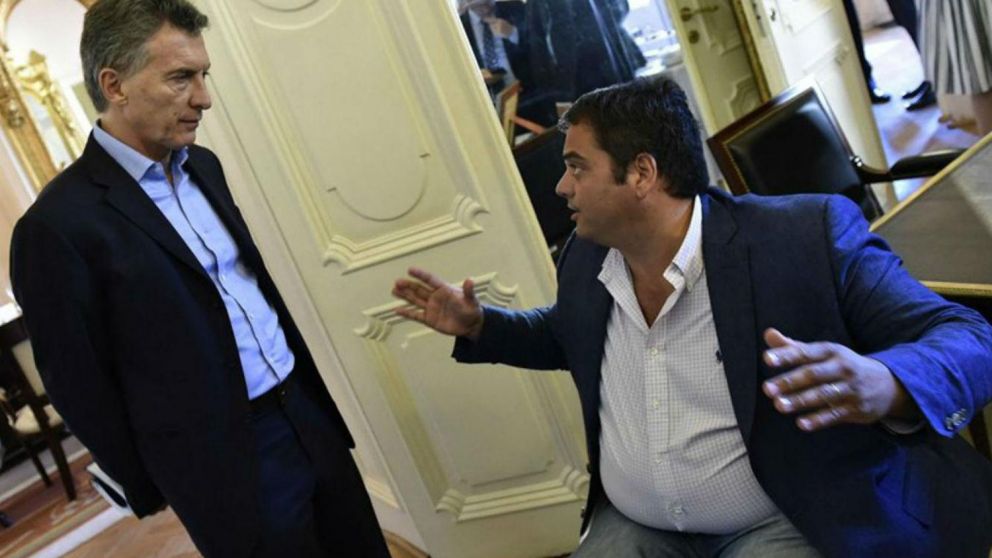 El ministro junto al presidente. (Archivo)