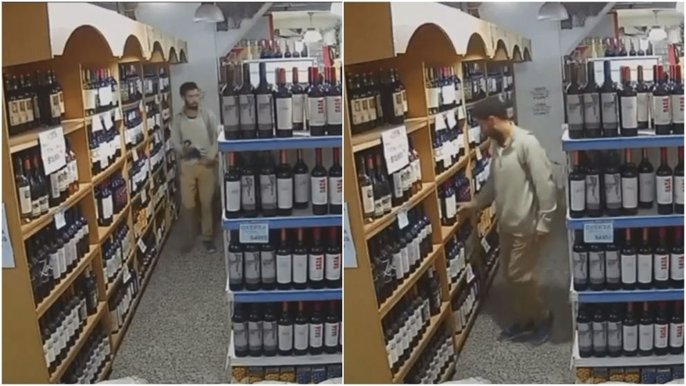 Así quedó filmado el ladrón de vinos dentro de un supermercado.