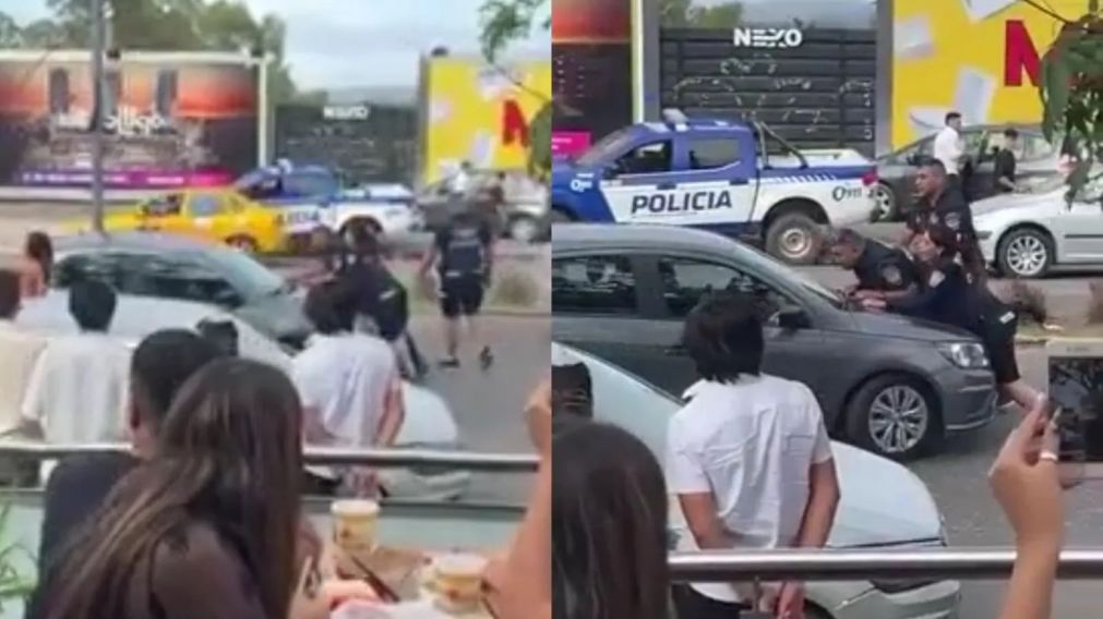 Un joven intentó evadir un control policial y arrastró a dos agentes en el capot de su auto (Imagen captura vídeo).